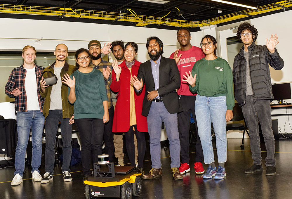 Student workers with Aniket Bera.