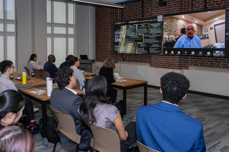 Manu Shah, Purdue Engineering alumnus and benefactor of the ShahLab.AI, addresses competitors virtually during the 2026 ShahLab.AI: AI For Social Good competition on Oct. 21 at Purdue HIVE. (Purdue University photo/Chad Krockover)